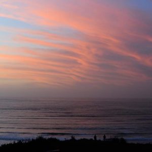 Sun setting over Raglan Beach