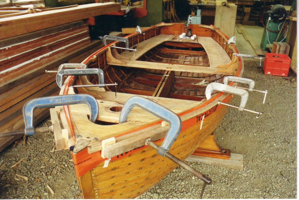 Steamed timber clamped onto the gunwales